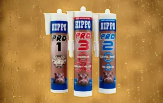 Cartridges of Hippo PRO3, PRO2 and PRO1 stand in front of a wet gold background