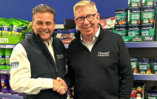 Guy Malam and Dell Fitzgerald shake hands in front of Hippo and Filltite products