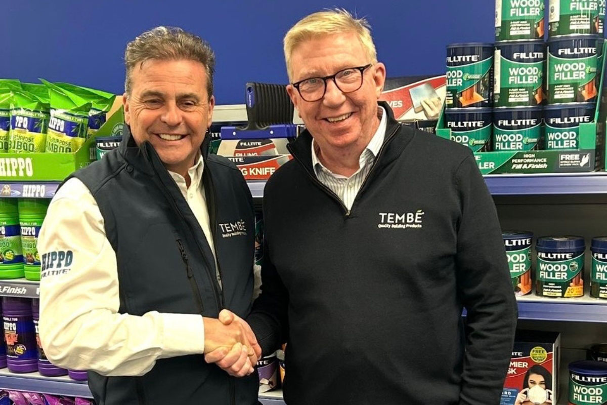Guy Malam and Dell Fitzgerald shake hands in front of Hippo and Filltite products